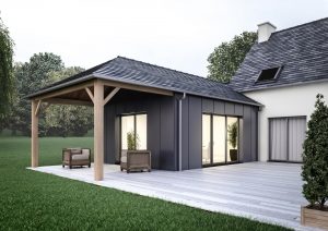 Extension de maison traditionnelle en ardoises avec préau et bardage en zinc Extension de maison traditionnelle zinc préau