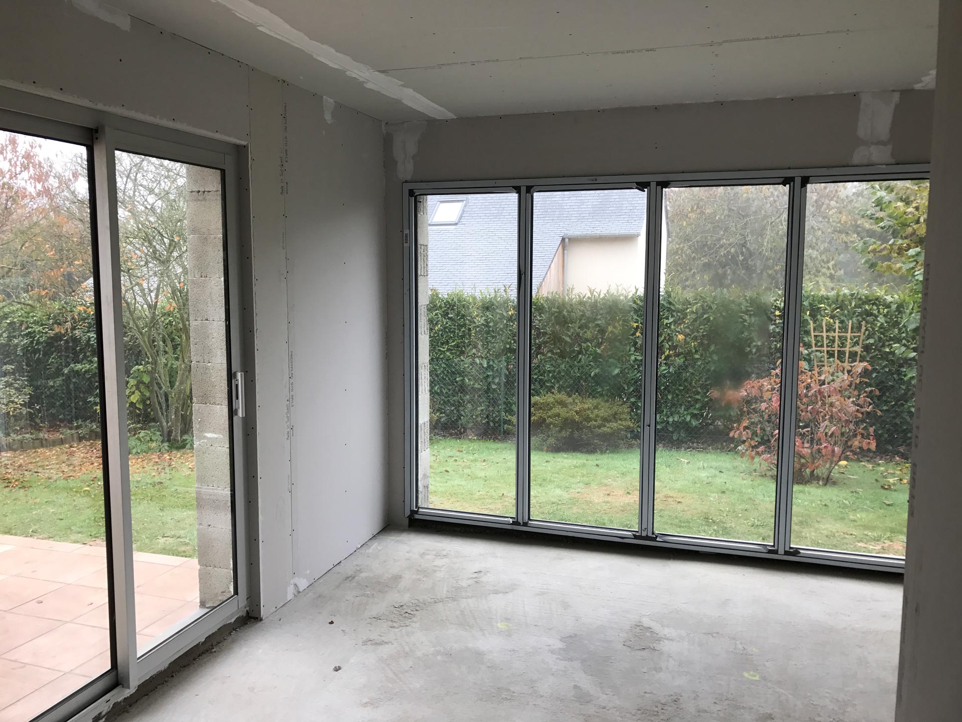 travaux agrandissement maison veranda toit plat 35520