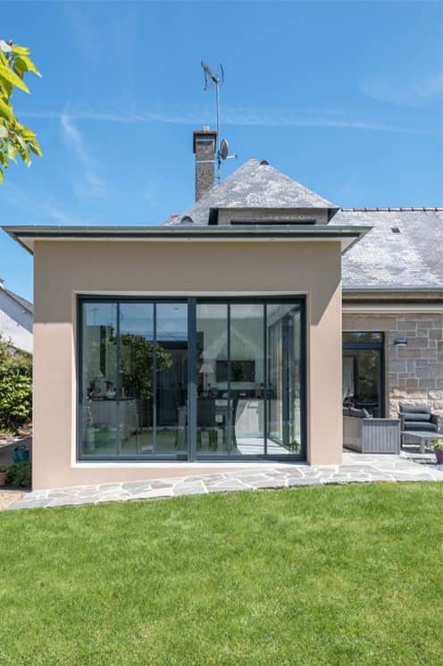 Une extension de maison traditionnelle avec 3 pans